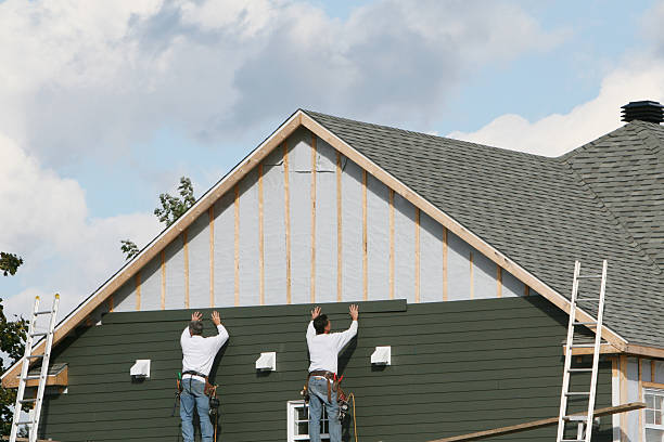 Professional Siding Installation technician working in Worcester, MA